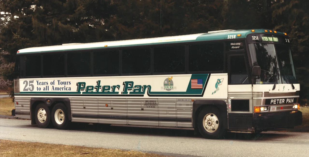 A Silver Side Peter Pan bus