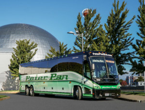 Peter Pan Bus Lines motorcoach parked outside the Naismith Memorial Basketball Hall of Fame in Springfield, Massachusetts.