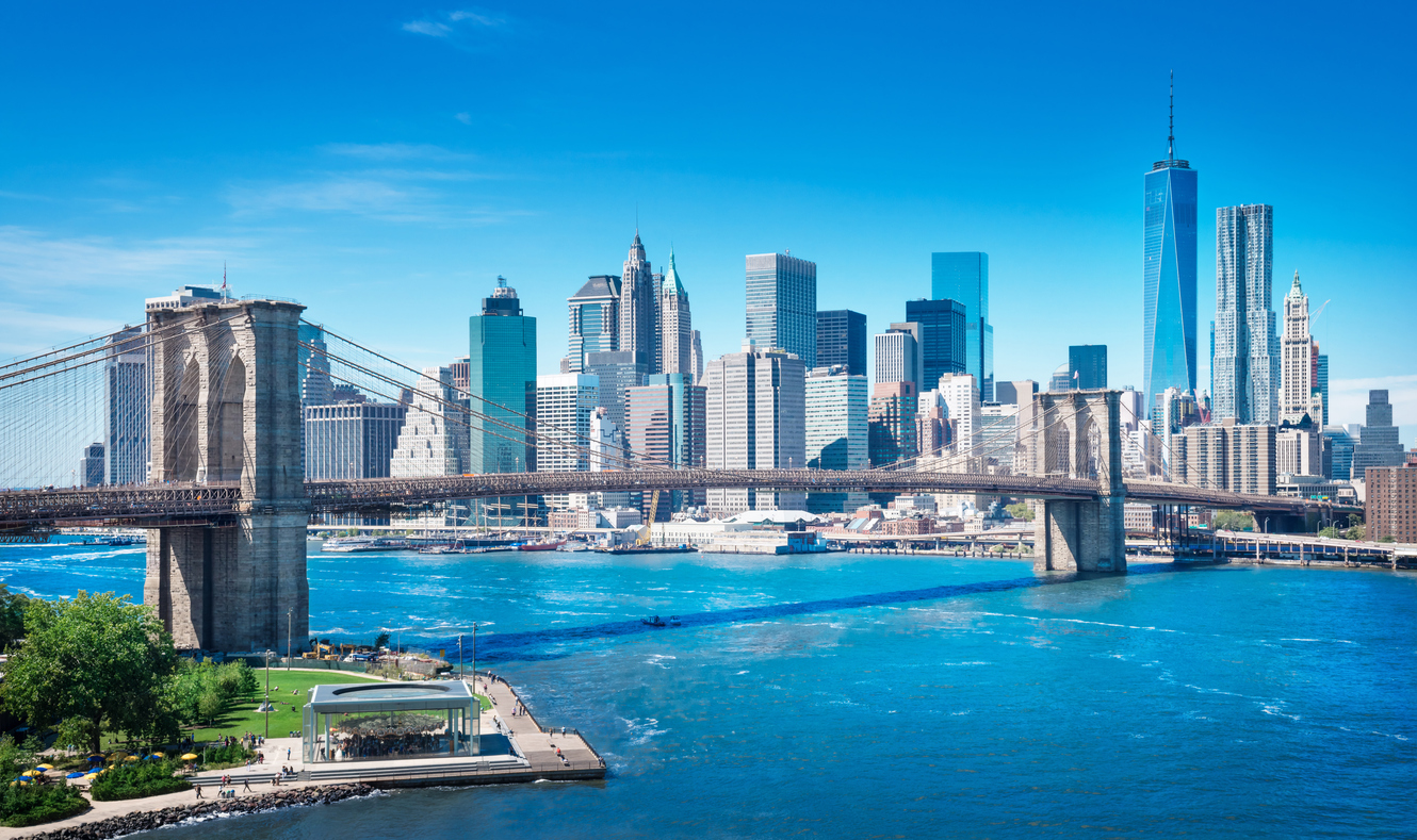 View of the Brooklyn Bridge and Lower Manhattan skyline—an iconic NYC destination reached easily with Peter Pan Bus Lines from Providence.
