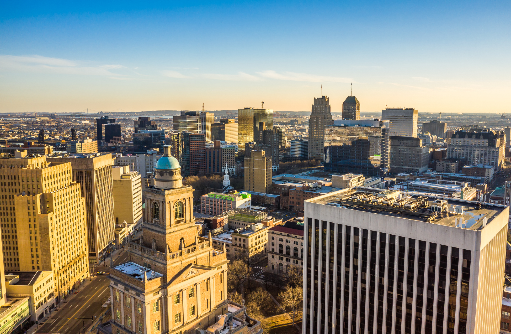 Downtown Newark skyline at sunset, featuring historic and modern architecture