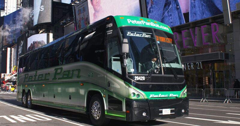 Peter Pan Bus arriving in Times Square, showcasing direct and reliable service from Providence to the heart of New York City.